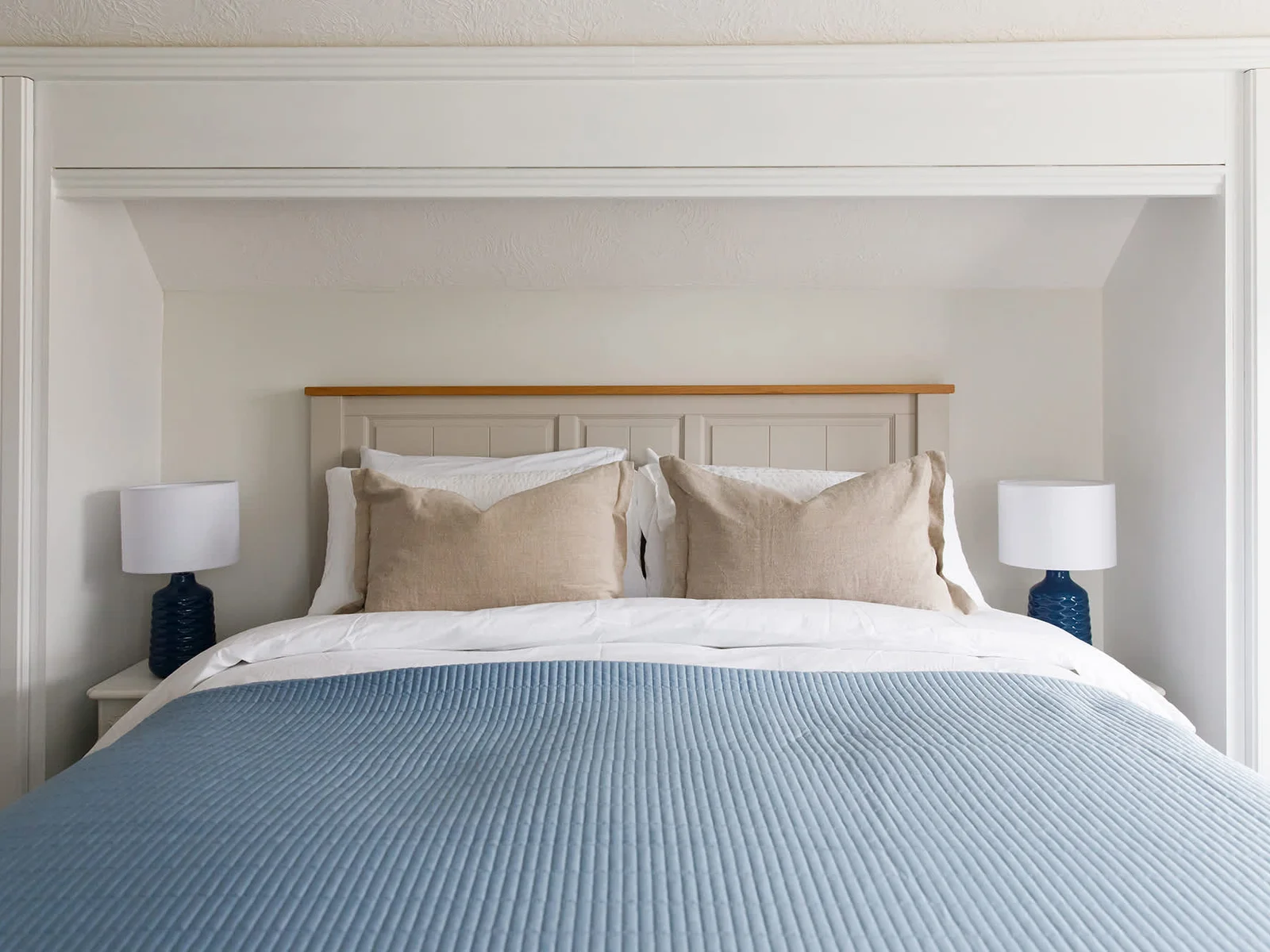 The first king room is light and bright, with soft blue furnishing.