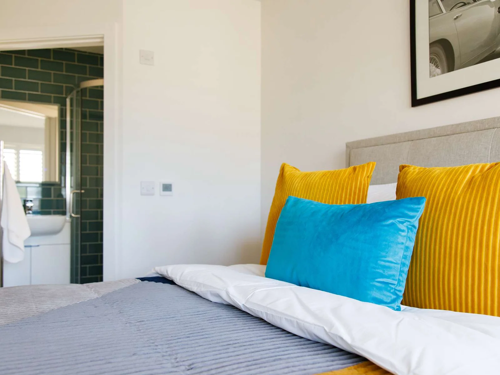The ground floor king bedroom has luxurious bedding and throws for a comfy night's sleep.