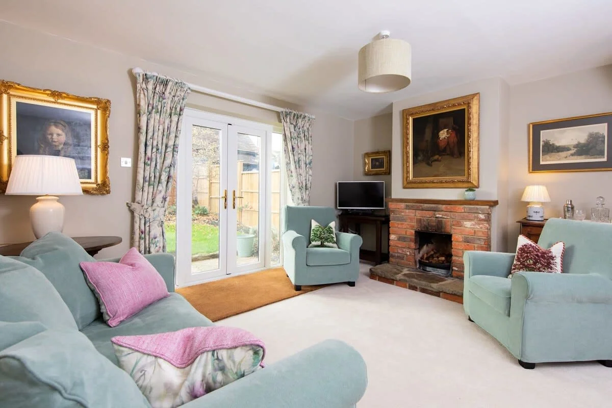 The lounge has a lovely view out to the garden.