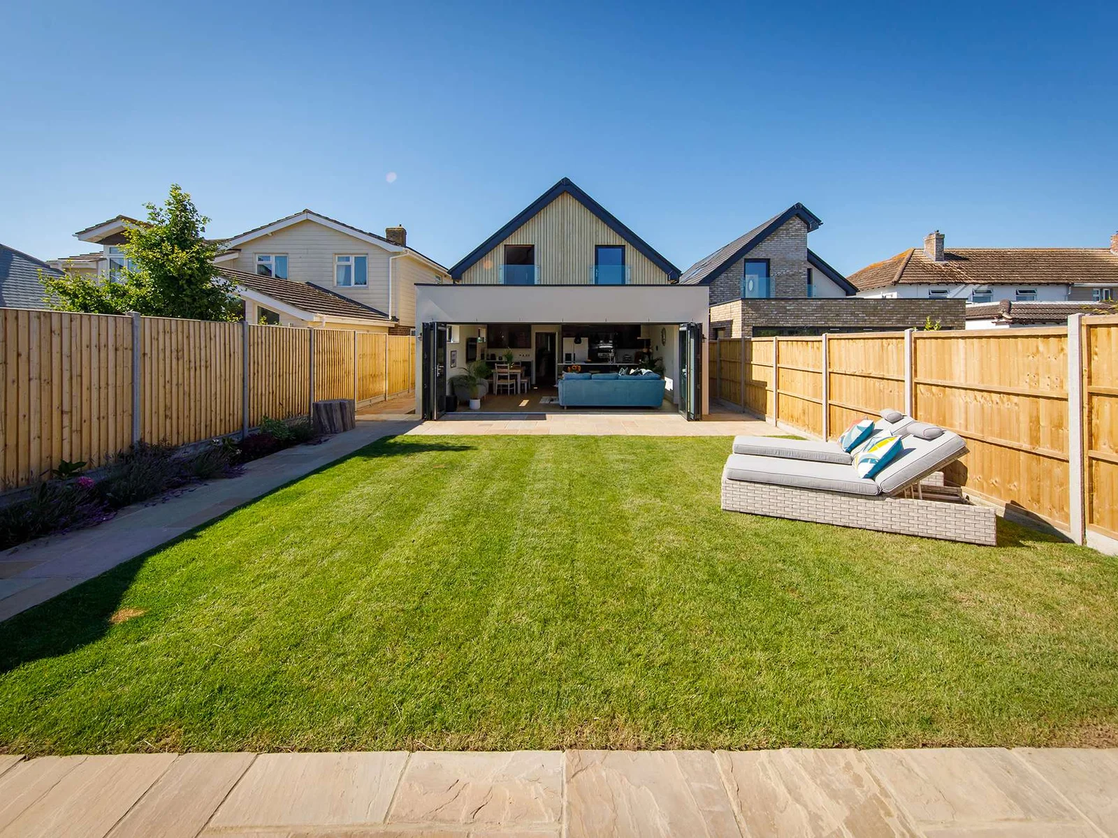 The sunny garden has sun loungers and garden furniture to enjoy al fresco dining.