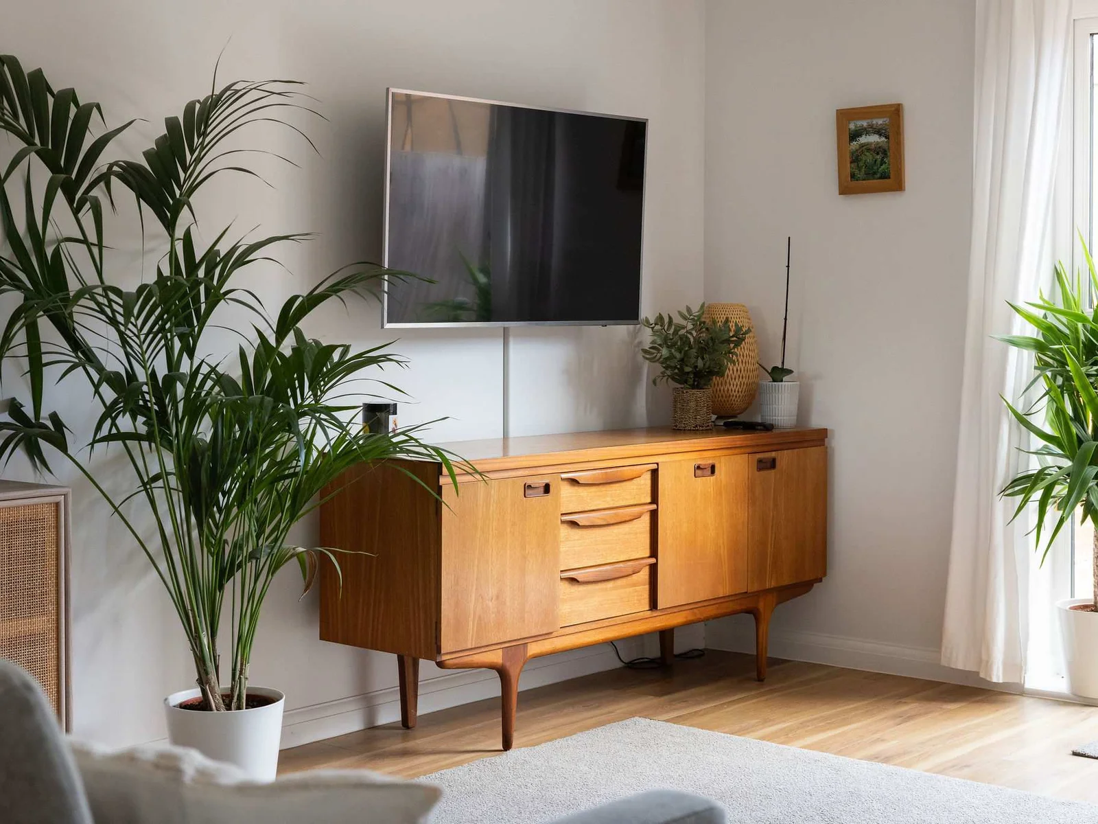Living area with 50" Smart TV and doors to the sunny garden.