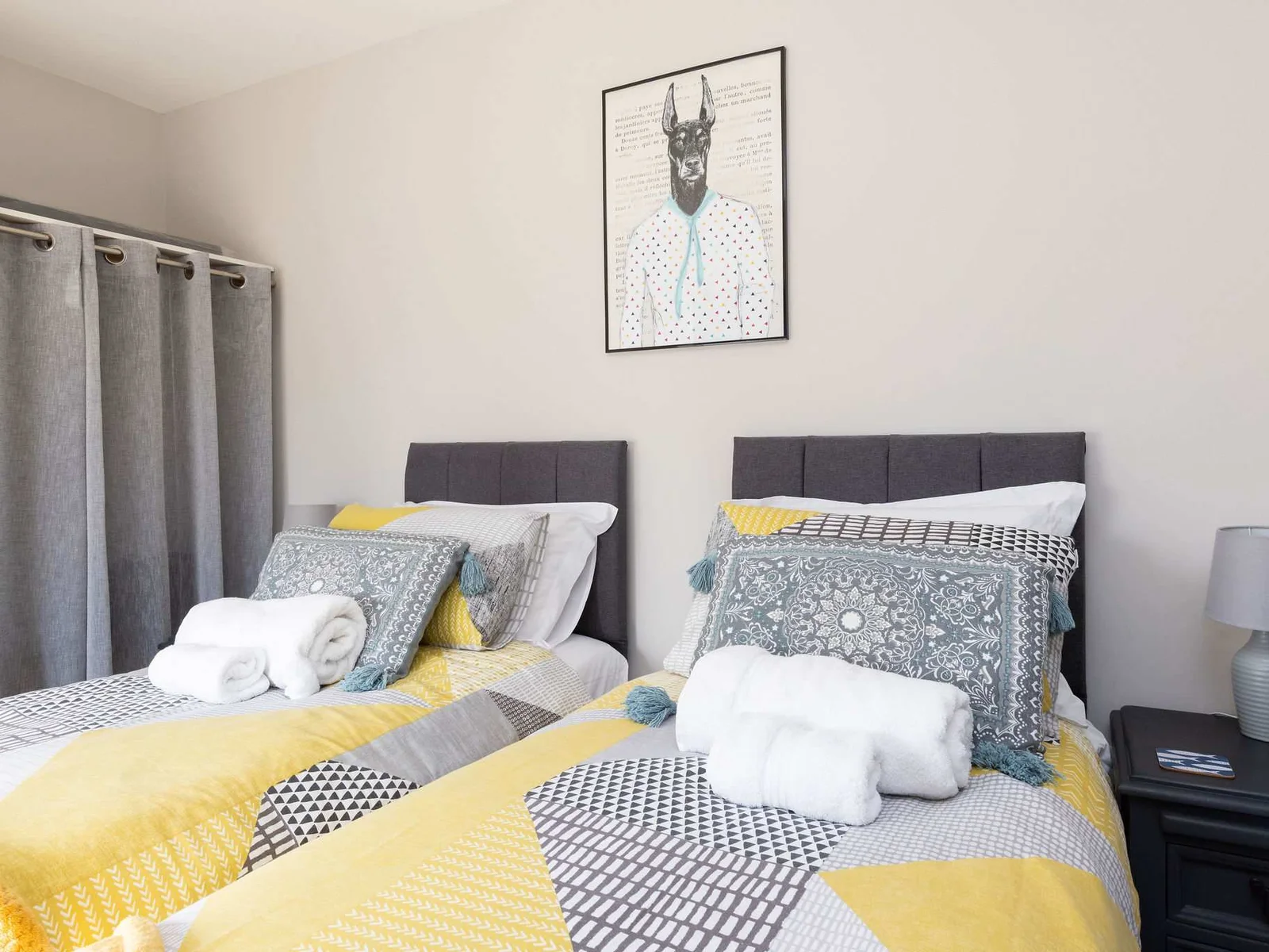 Bright twin bedroom, ideal for families or friends enjoying a relaxing coastal retreat