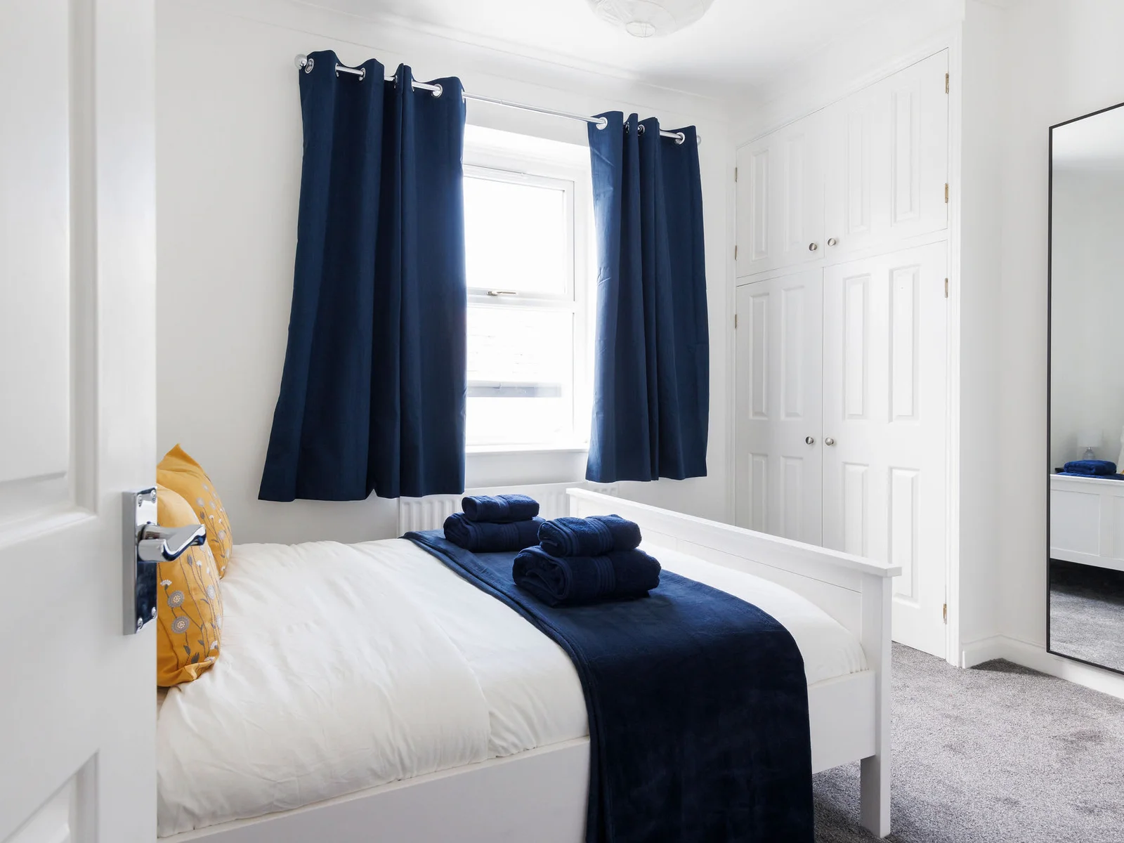 The master bedroom has a comfy king bed and plenty of space for your belongings.