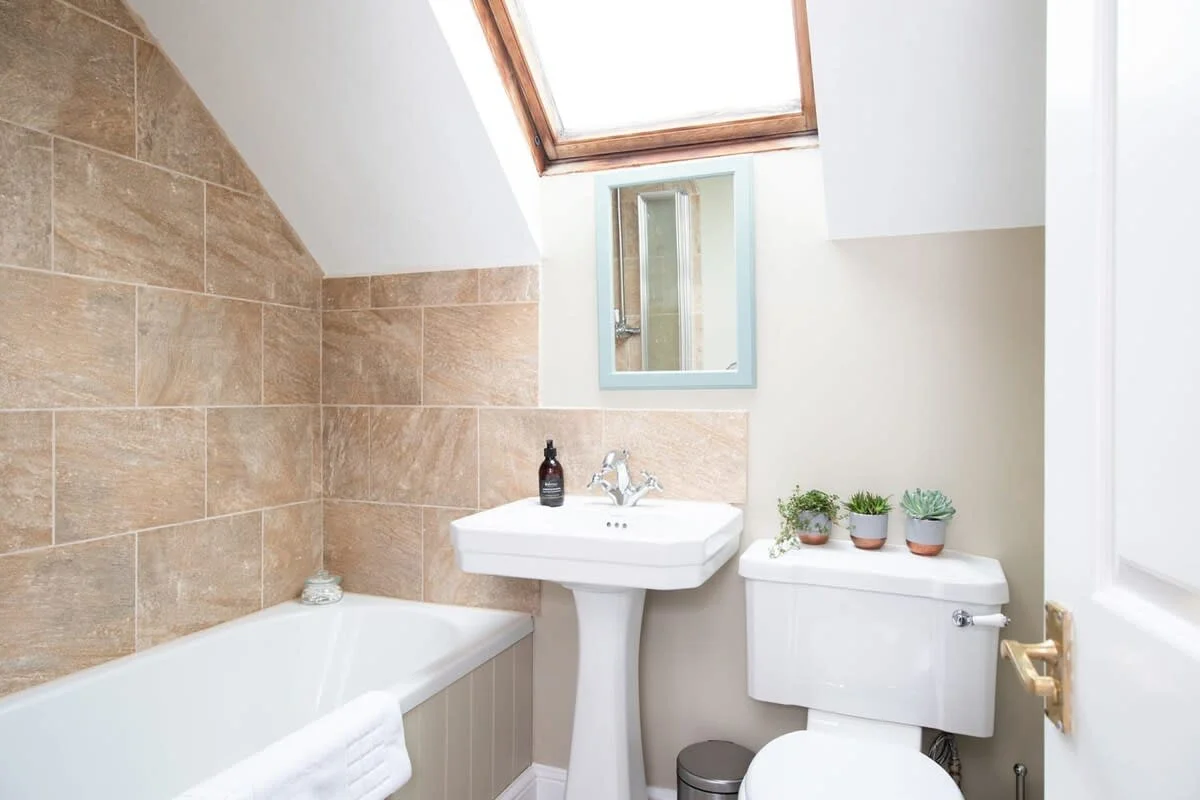 The bathroom is a good size with bath, shower, WC and sink.
