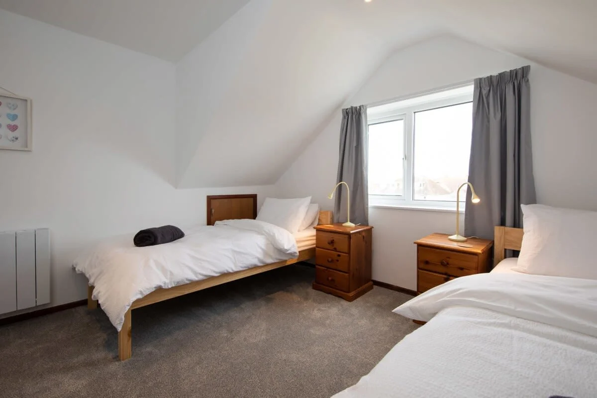 The spacious double loft bedroom (bedroom ten) with two twin beds