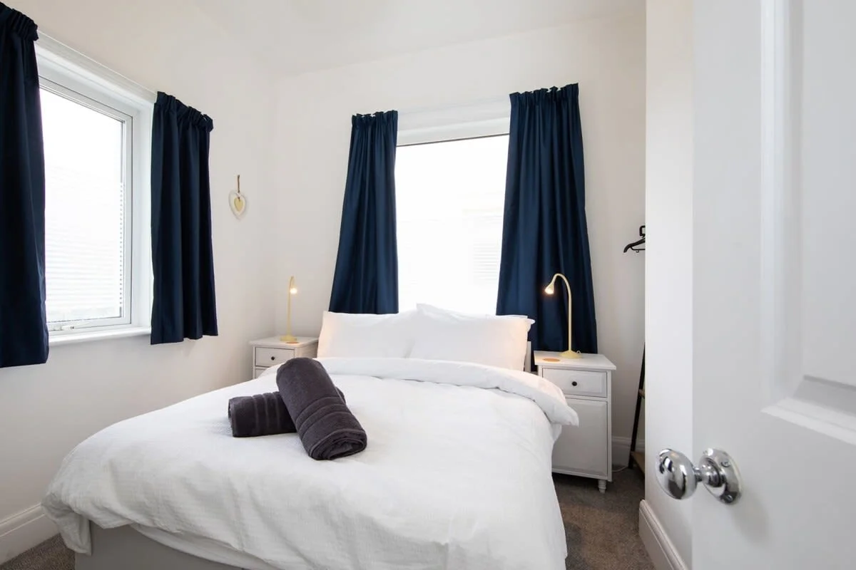 The elegant double bedroom filled with natural light