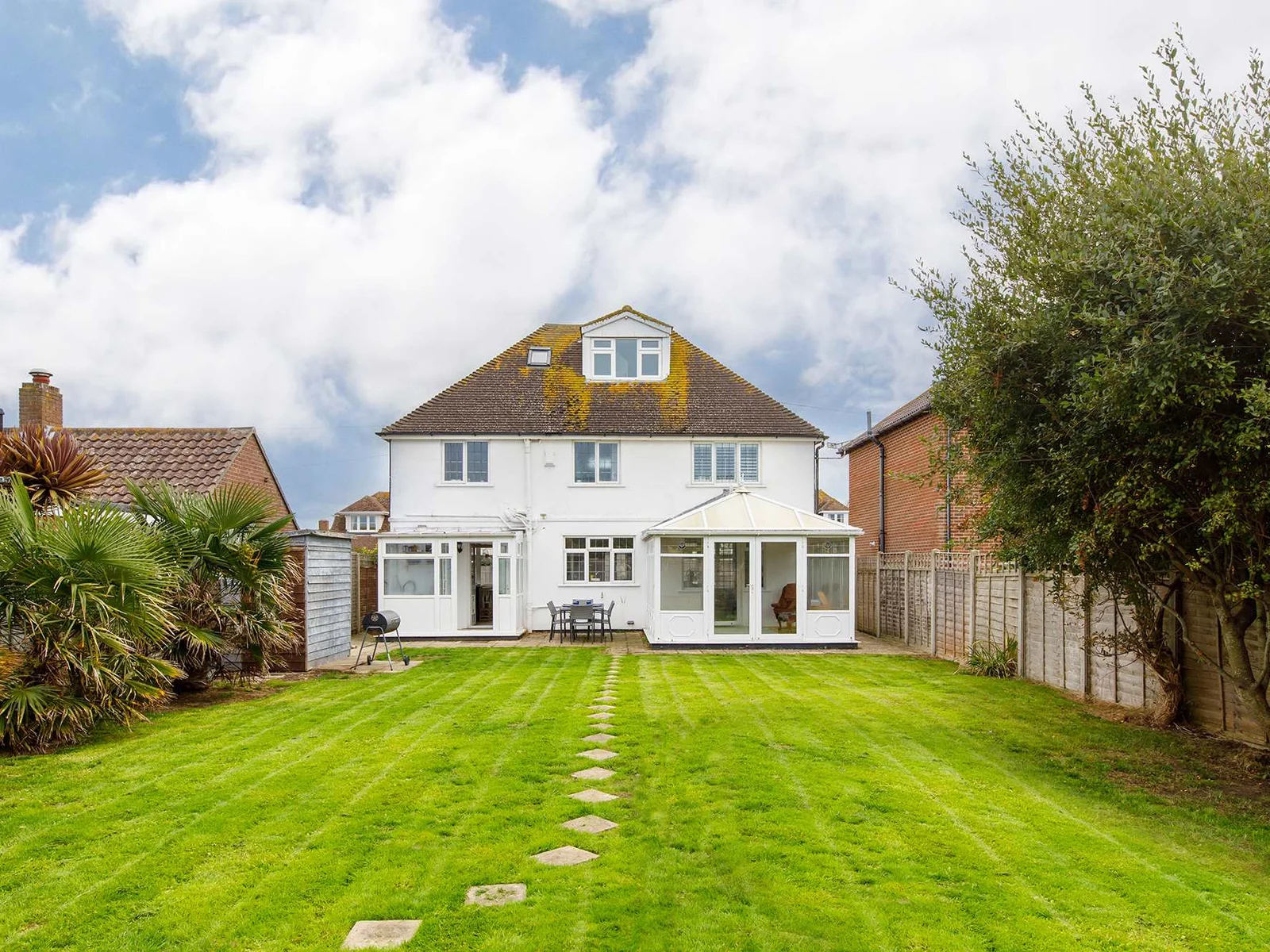 The spacious garden is perfect for ball games and other family fun.