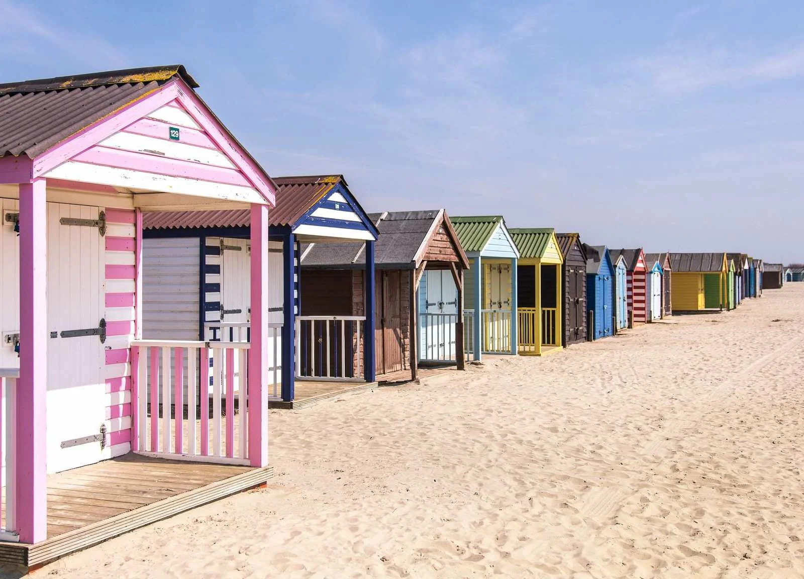 Colourful beach huts at West Wittering. 6/7 minute drive from the house.