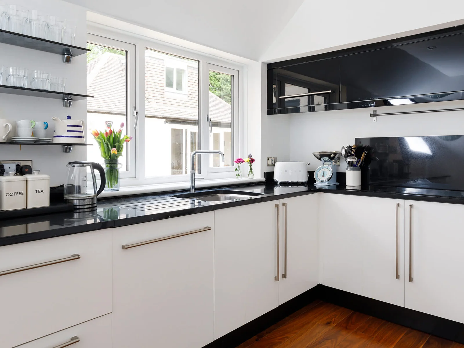 The kitchen has a electric hob, double oven, double fridge and dishwasher.
