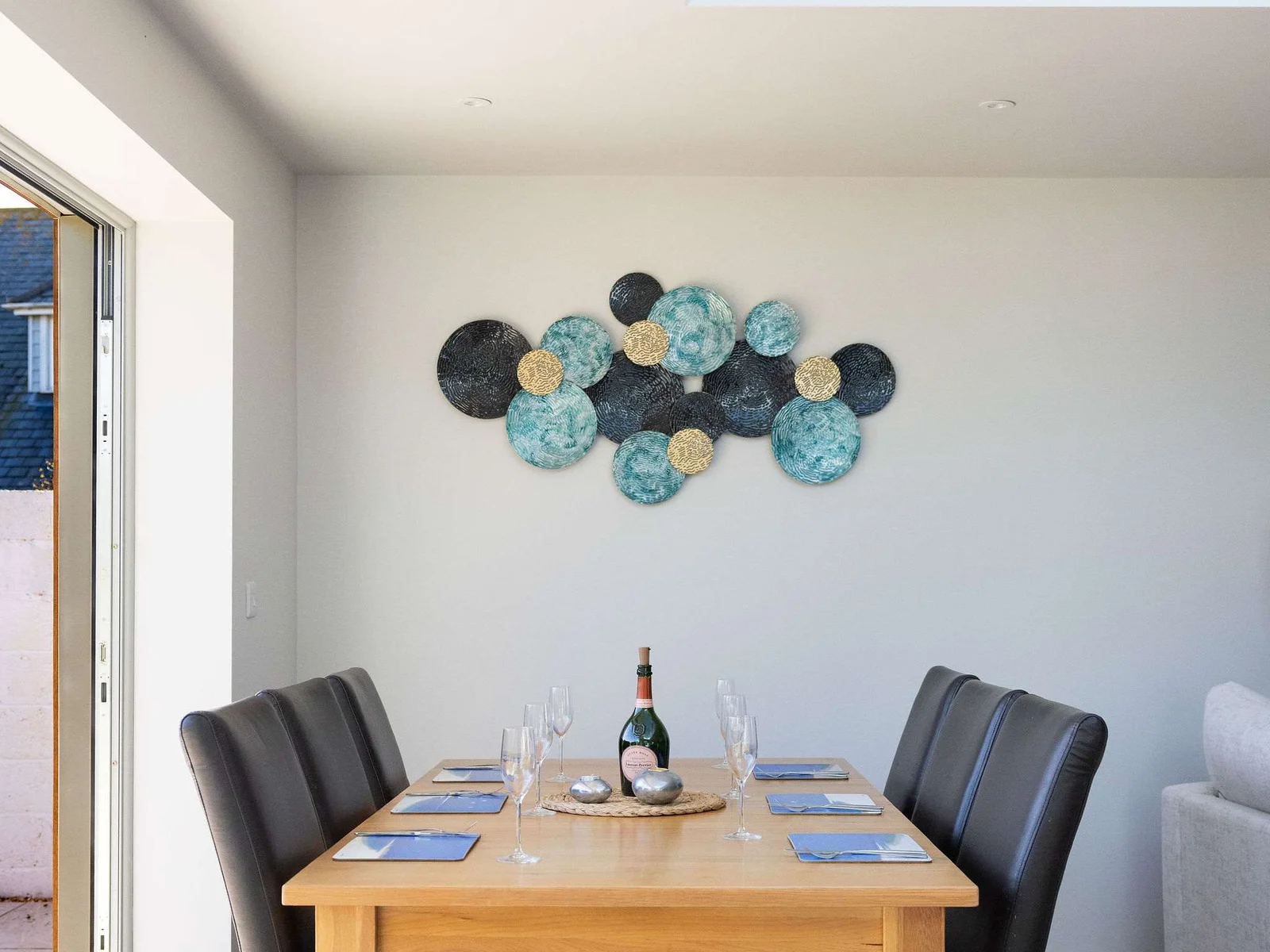 Stylish coastal retreat with a welcoming dining space, perfect for relaxed meals during your seaside stay.