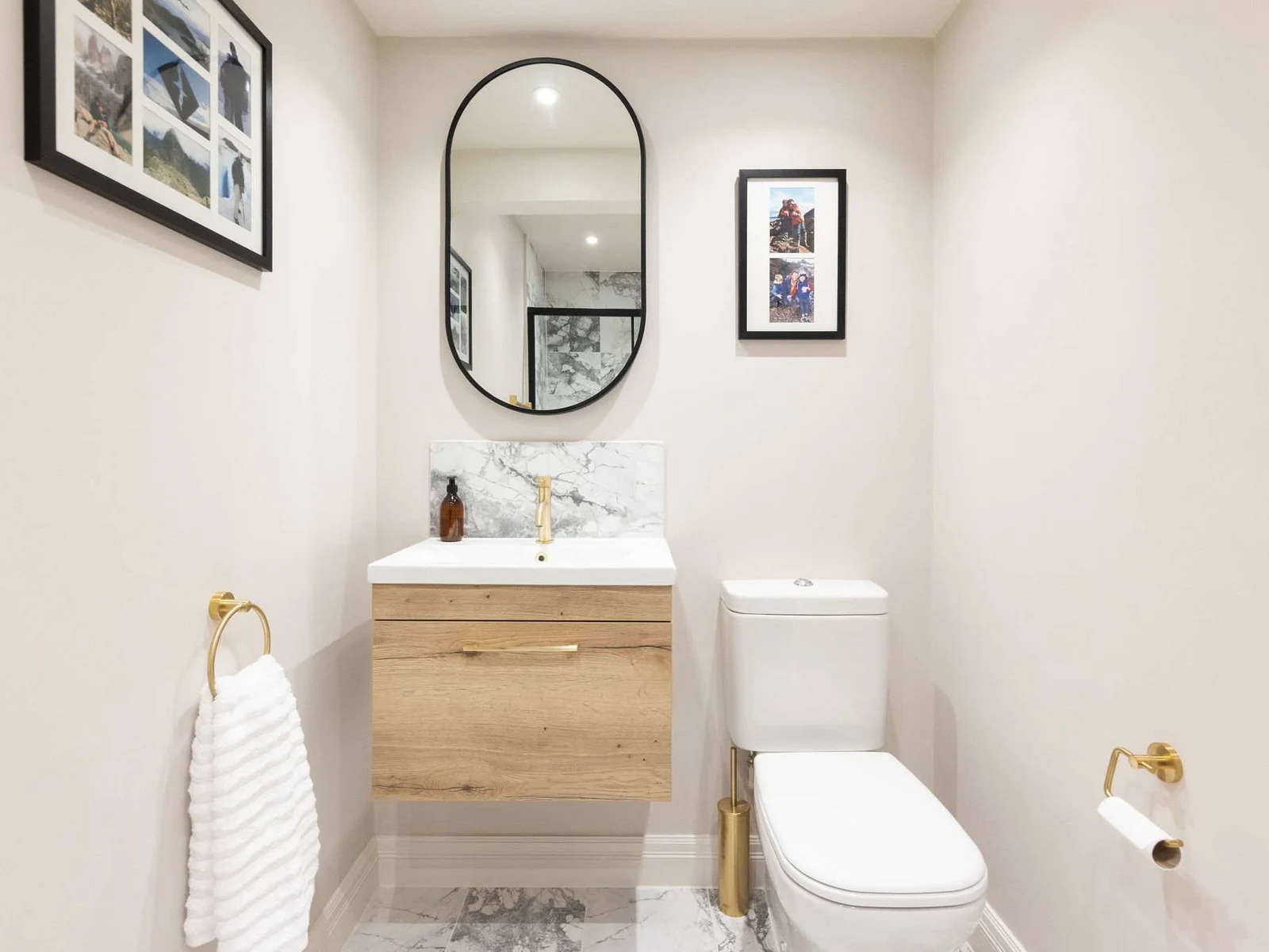 Modern downstairs WC with gold and marble accents
