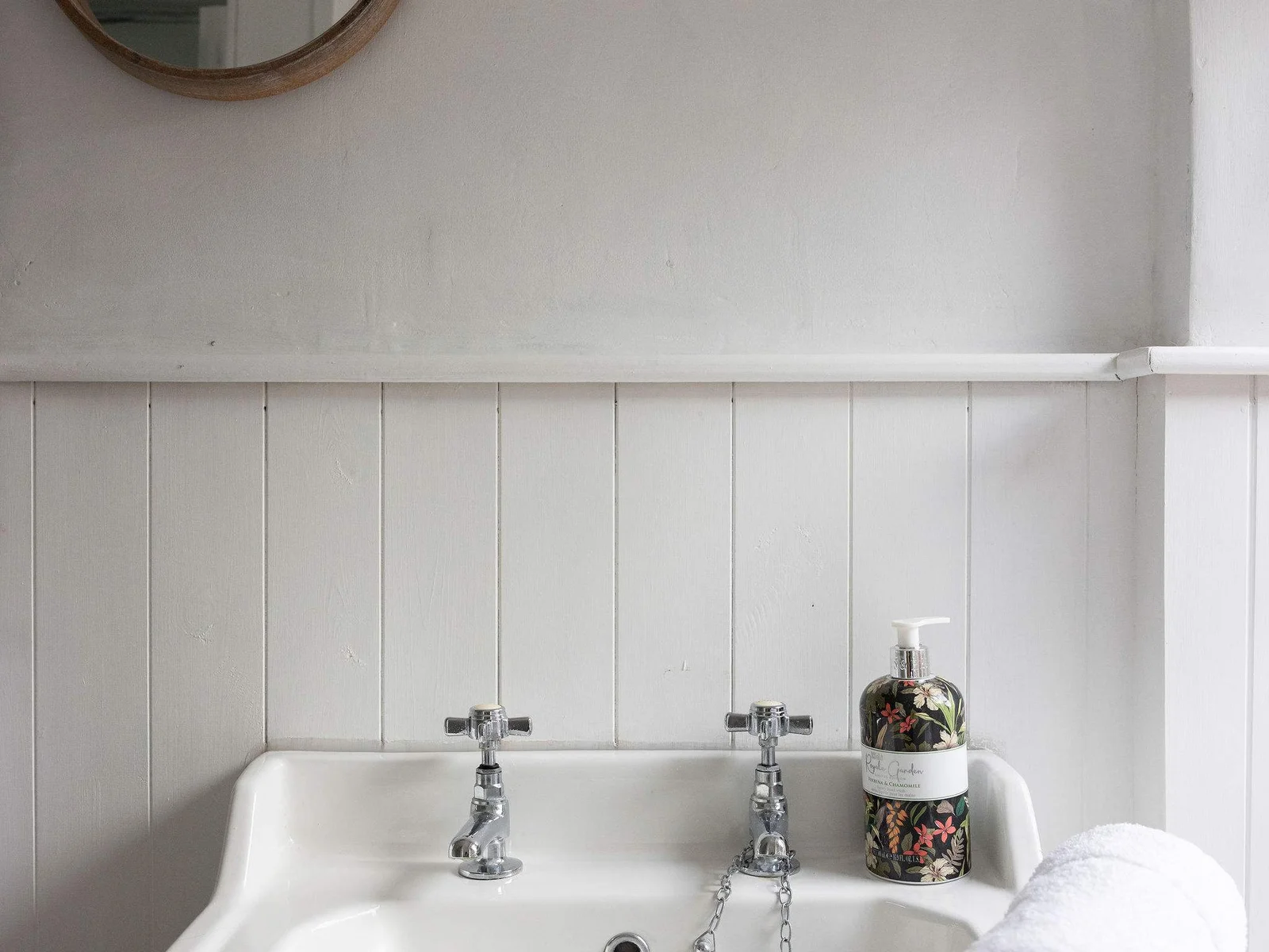 The bathroom is well stocked with towels and essential toiletries to freshen up after a day at the beach.