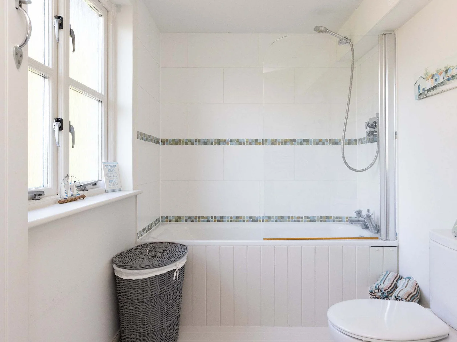 Family bathroom with bath and overhead shower