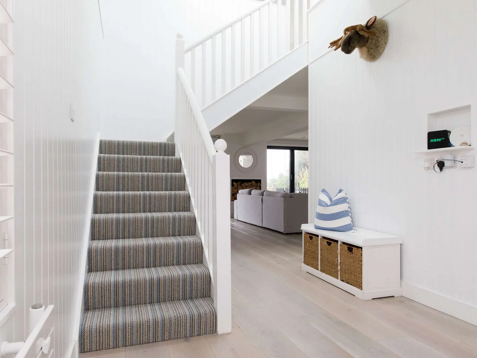 A bright and airy hallway you will find the stairs that leads up to the first floor.