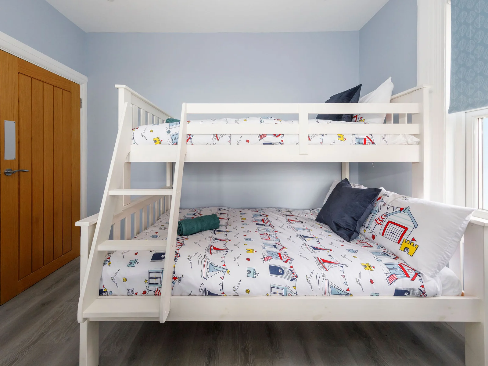 Family Fun: Cozy Up in Our Playful Triple Sleeper Room