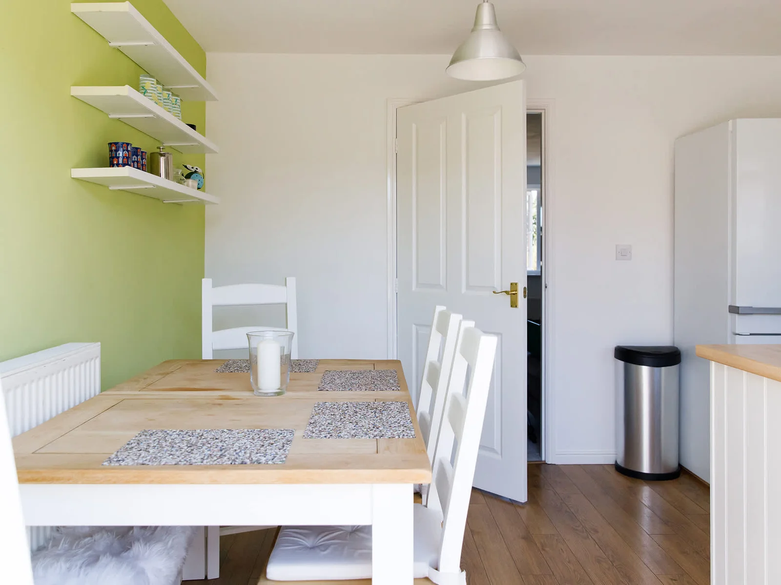 The kitchen has dining space with a table and chairs to seat up to 6 people.