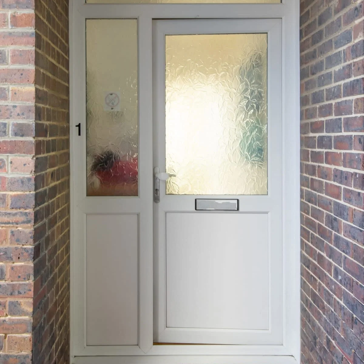The apartment has a private entrance at the rear of the property.
