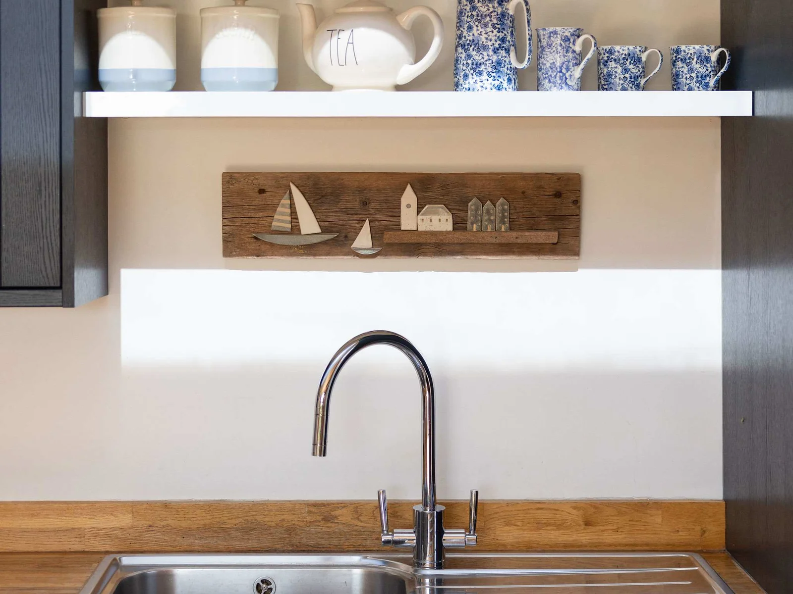 Well-equipped kitchen with charming touches.