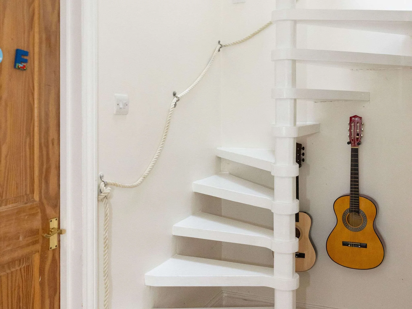 Spiral staircase up to the third floor, keep fit area and 3rd bedroom
