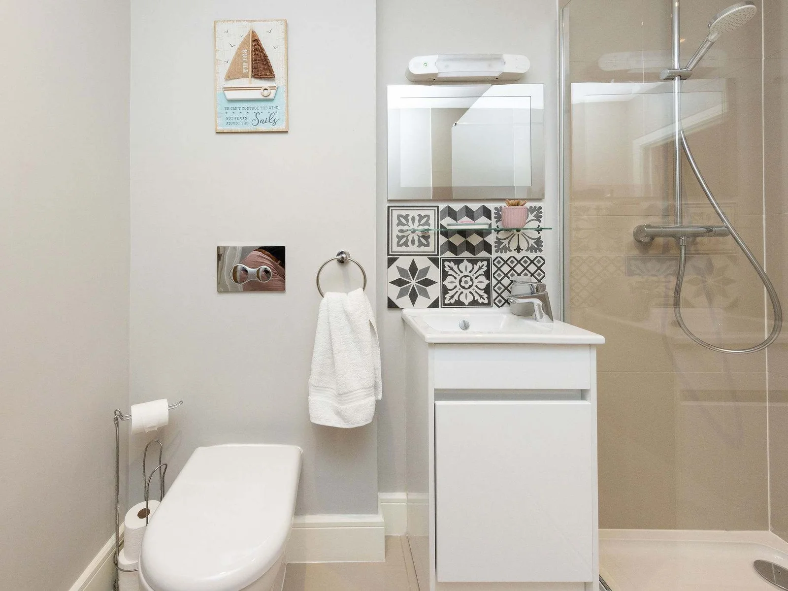 Modern ensuite shower room with stylish finishes for added comfort during your seaside stay