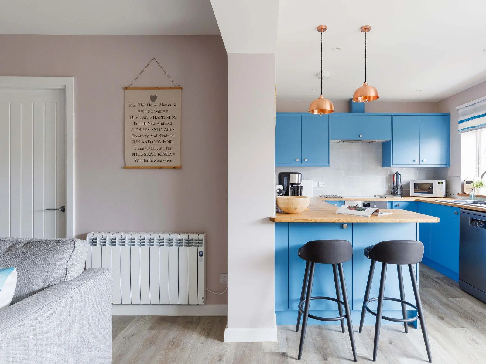 There is additional seating at the kitchen's breakfast bar.