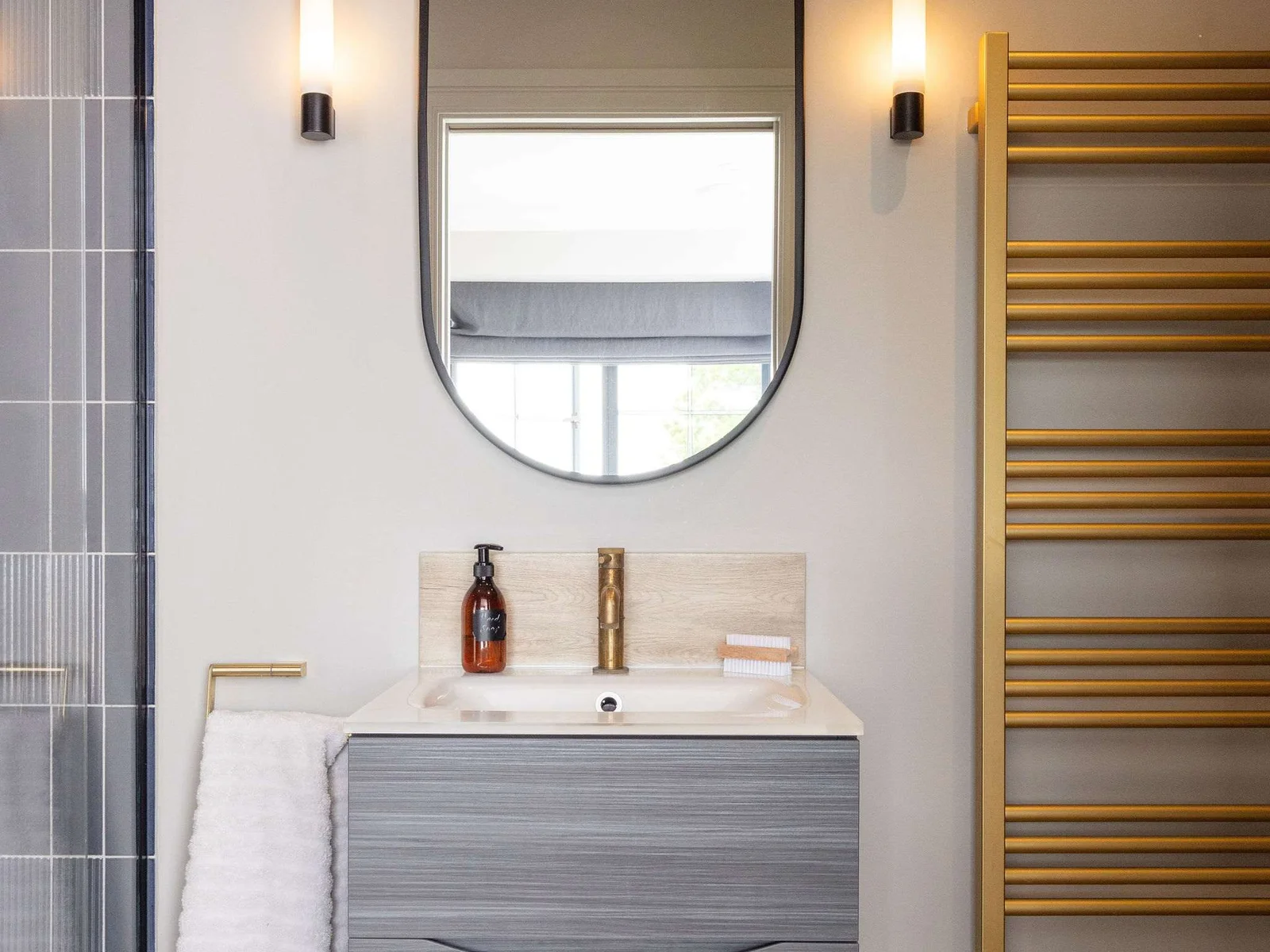 Contemporary en-suite with bold gold accents