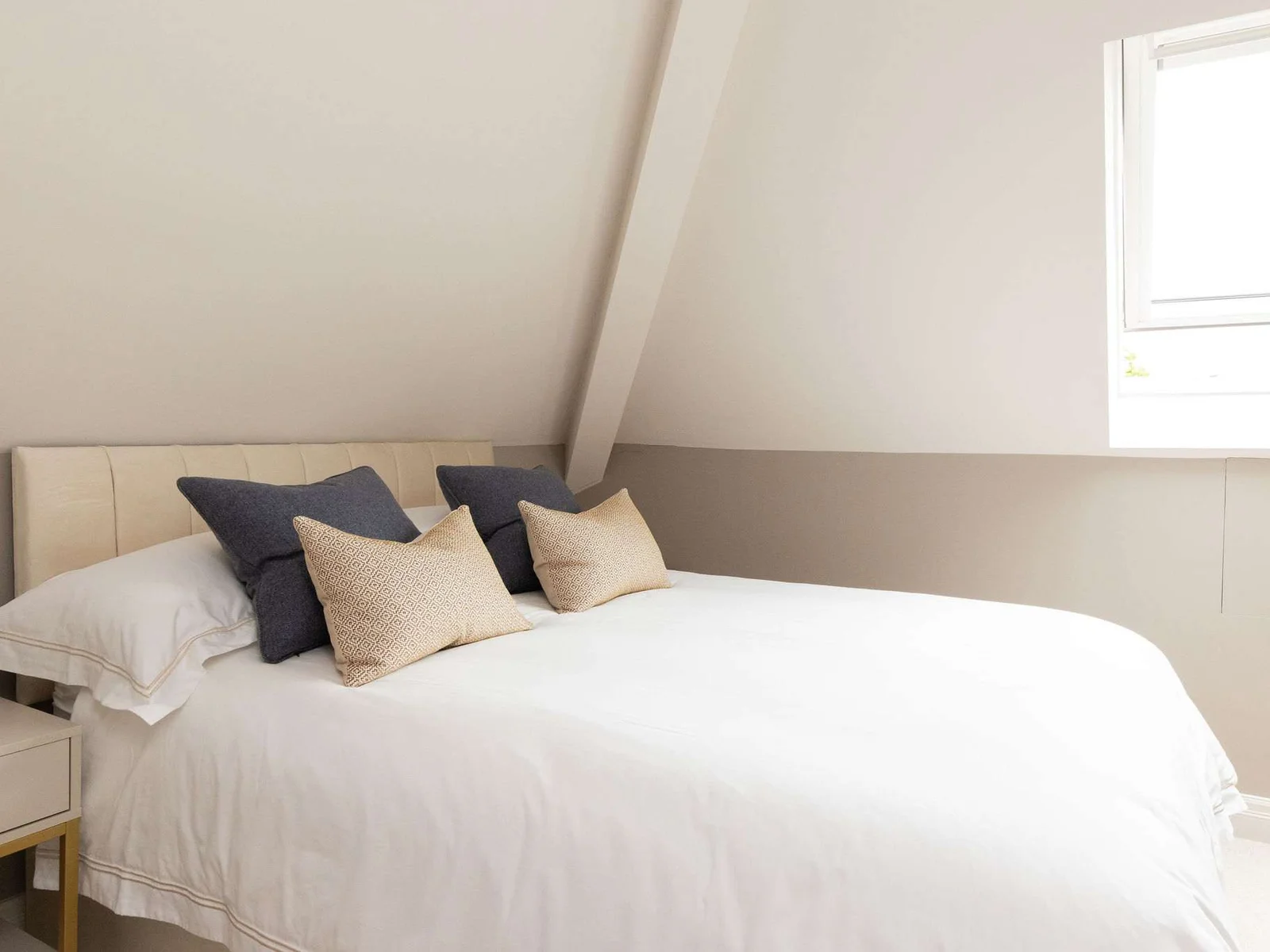 Cosy top-floor triple bedroom with soft natural light