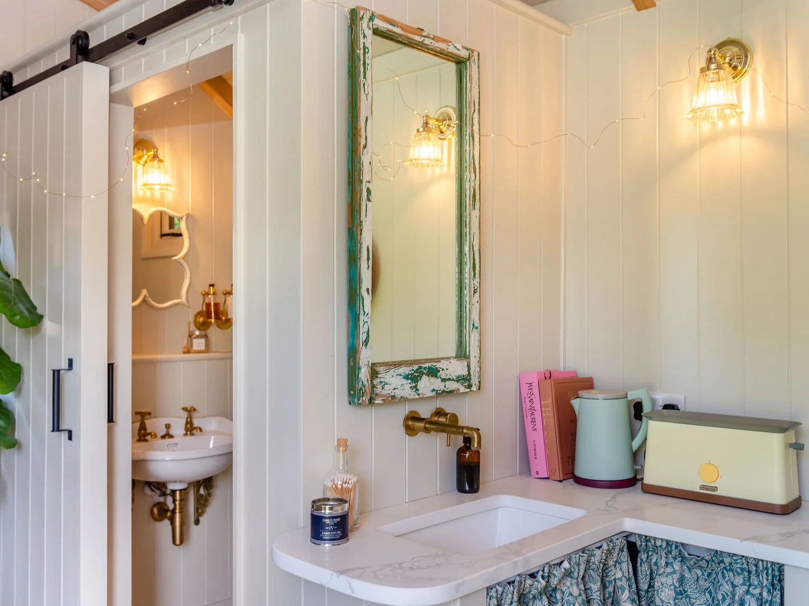A cleverly designed kitchenette and private bathroom within the Shepherd’s Hut
