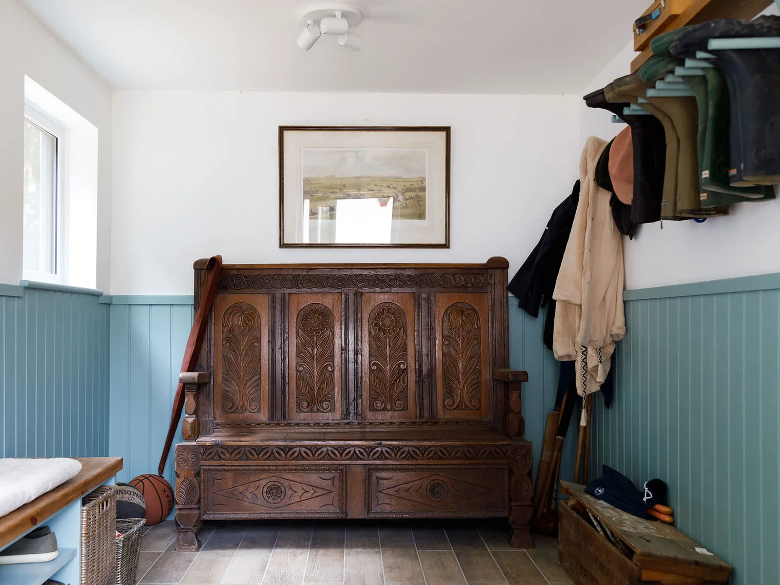 The boot room has storage for the tennis equipment and croquet.