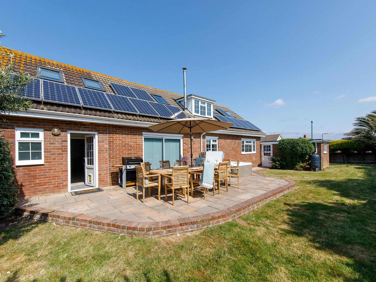 The home has a great outdoor space, with lawn, patio, hot tub, BBQ and dining furniture. What more could you want?
