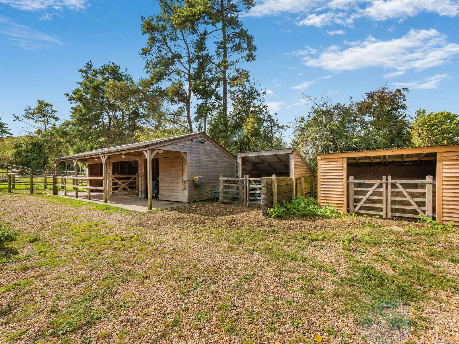 Private stabling and shelters, set within the estate’s equestrian grounds.