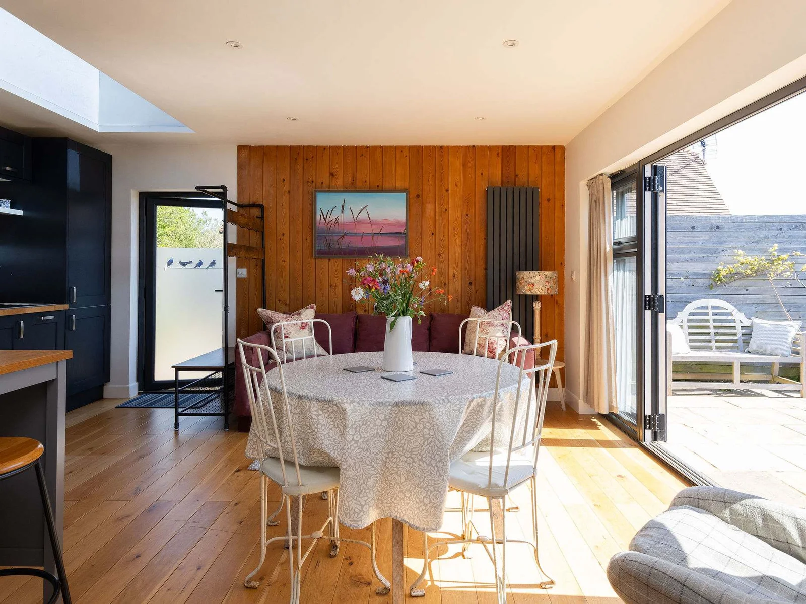 The living space has a dining table for 4 guests, perfect for breakfast.