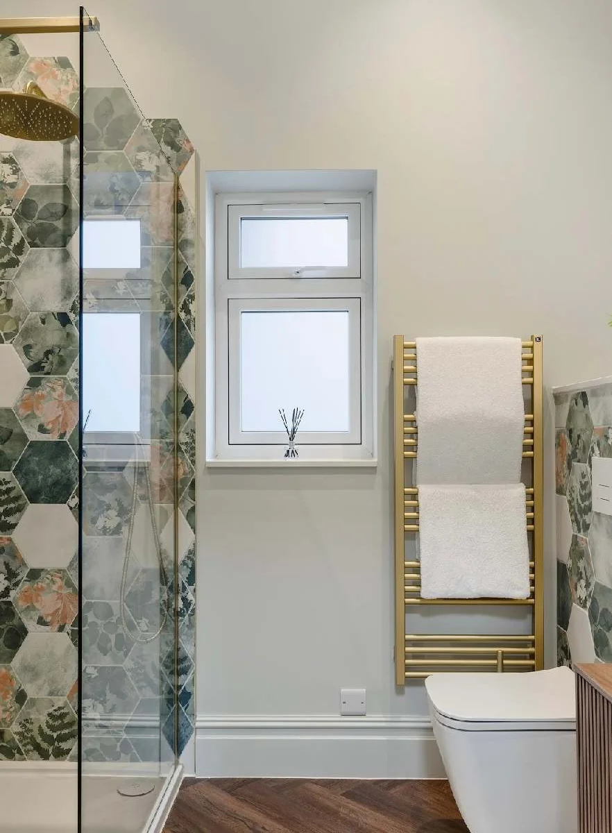 Bright and beautifully finished shower room.