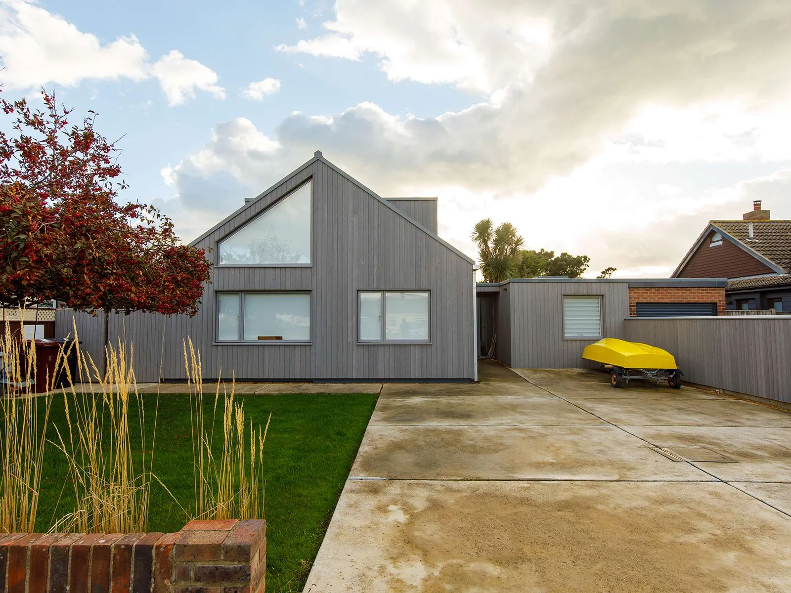 The home has a stylish and striking exterior with plenty of parking space.