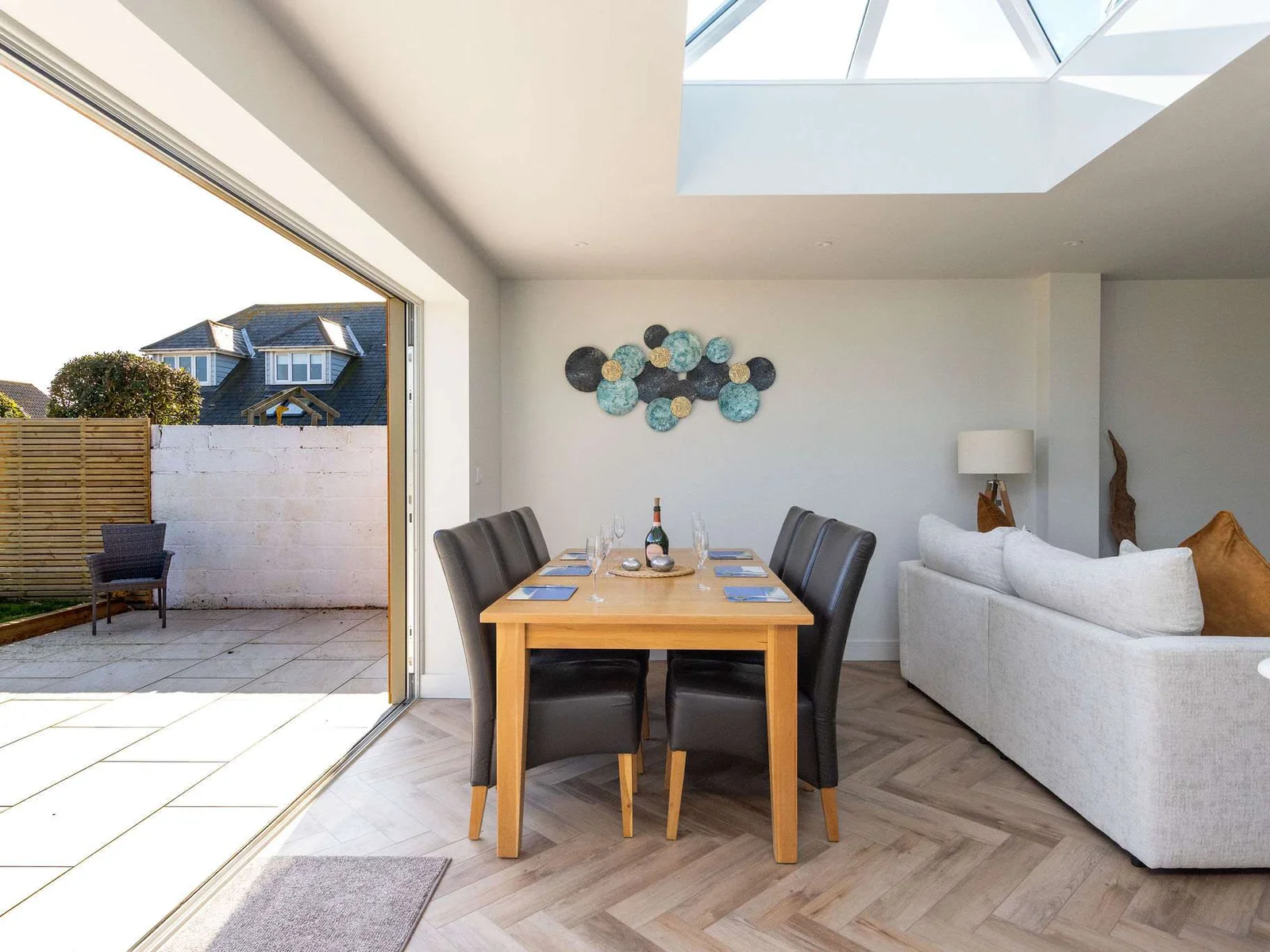 Stylish open-plan living with easy garden access, ideal for indoor-outdoor coastal living.