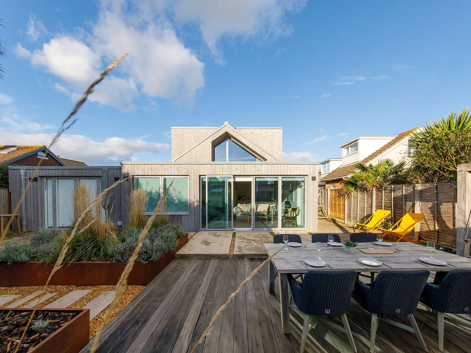 Head outside to discover a beautifully landscaped and decked garden, perfect for socialising, dining and relaxing.