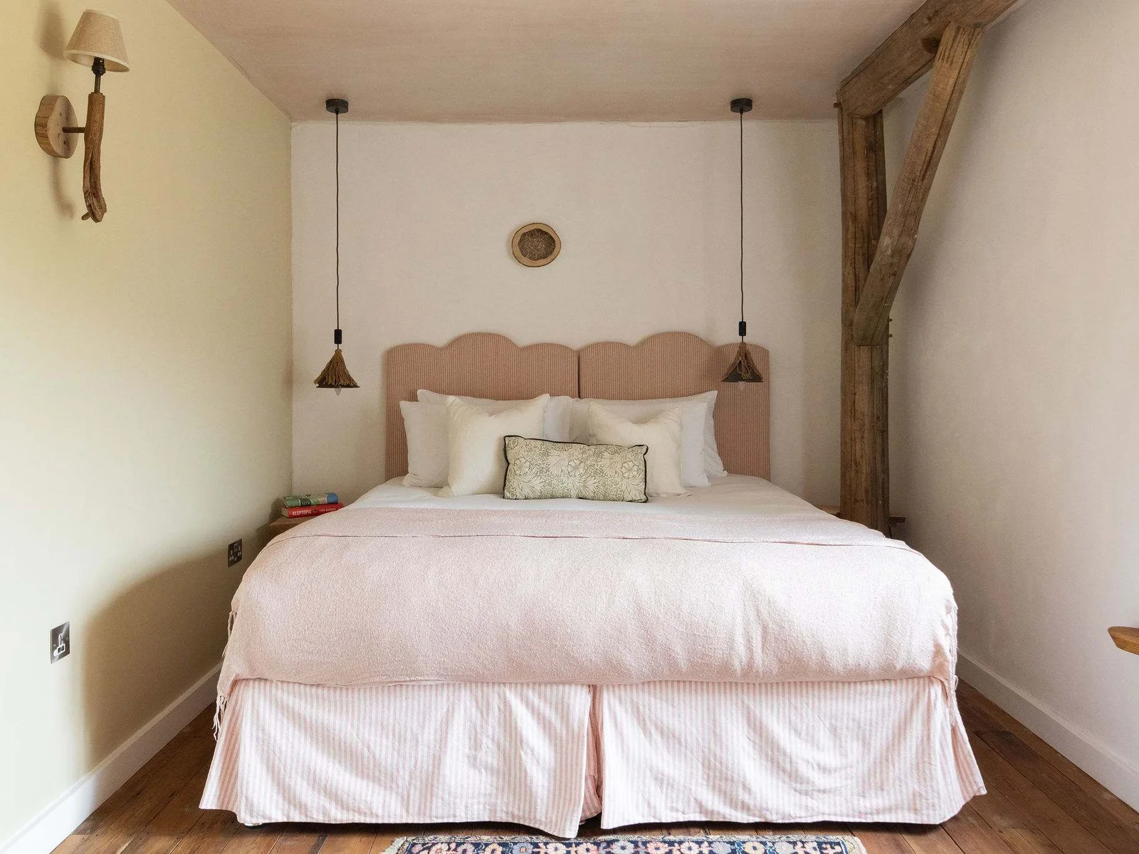 Sink into serene countryside slumber with soft linens and rustic handcrafted touches.
