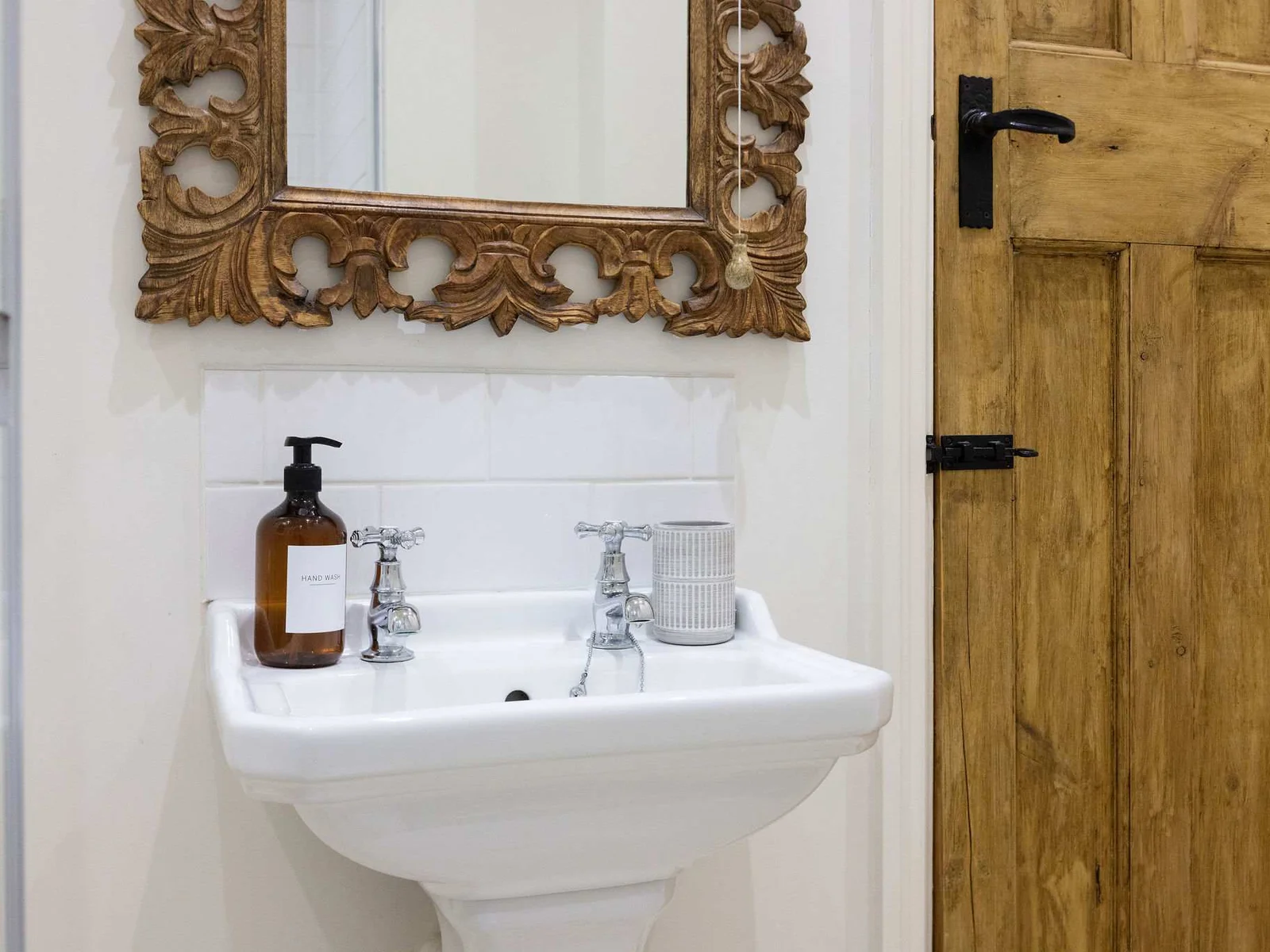 Thoughtfully styled bathroom with charming rustic touches.