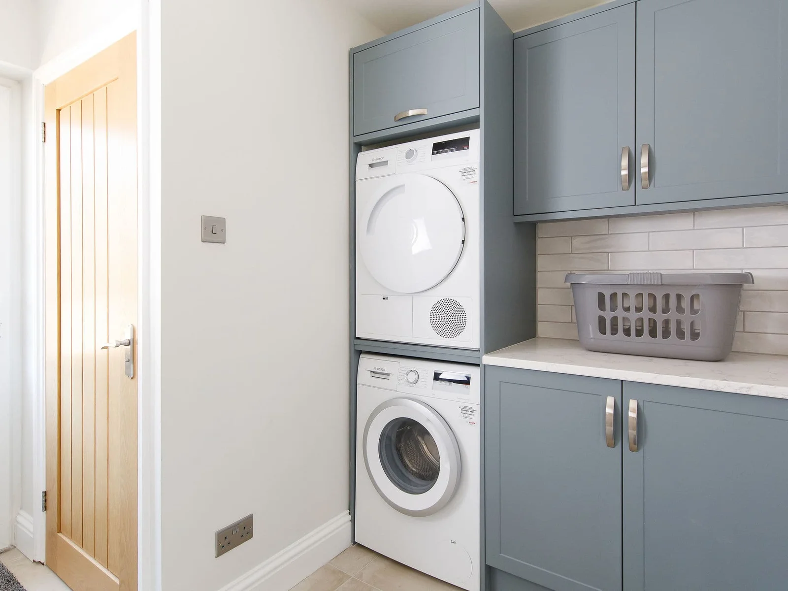 The handy utility room has a washer and dryer.