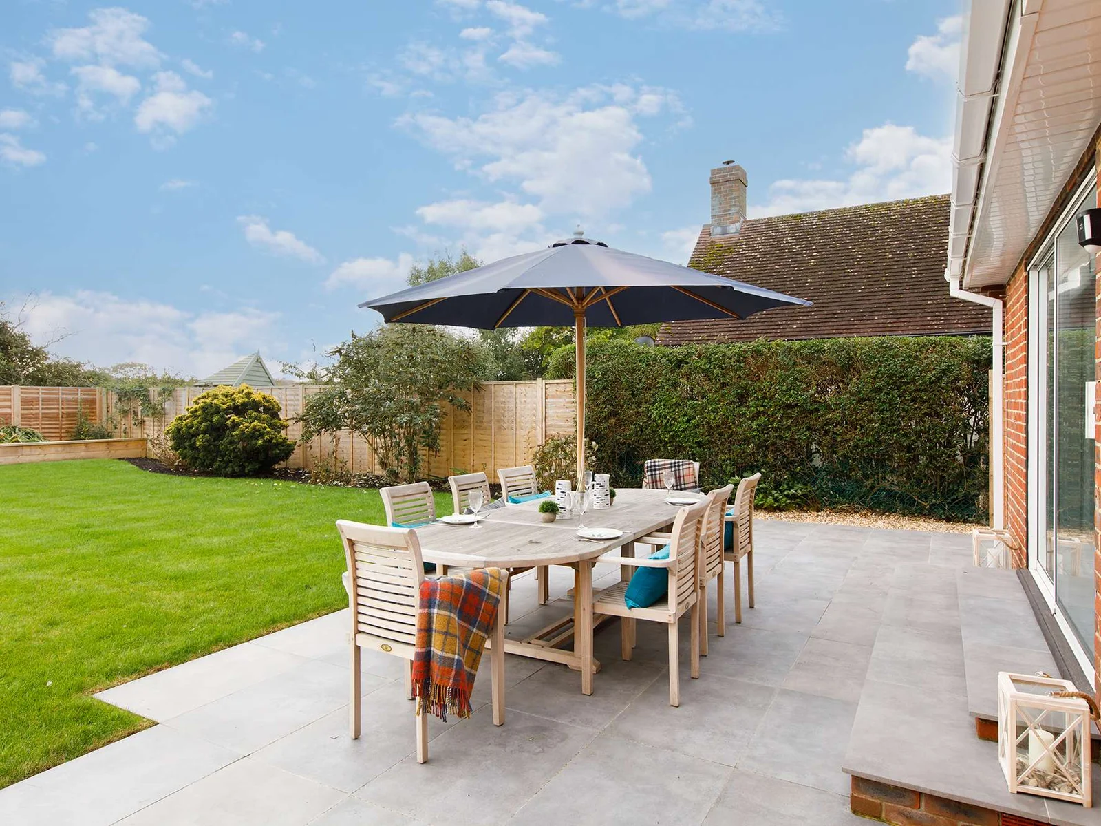 The living room doors open up to the patio, perfect for BBQs or drinks.