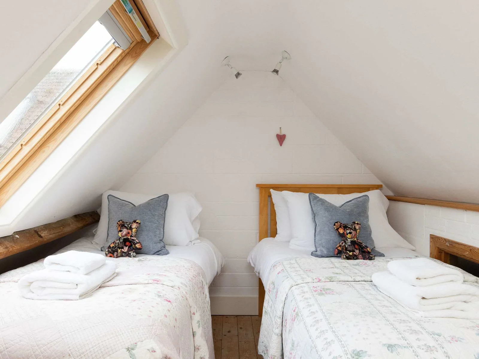The upstairs mezzanine floor in The Dairy is home to the third bedroom, which features a single bed and pull out trundle.