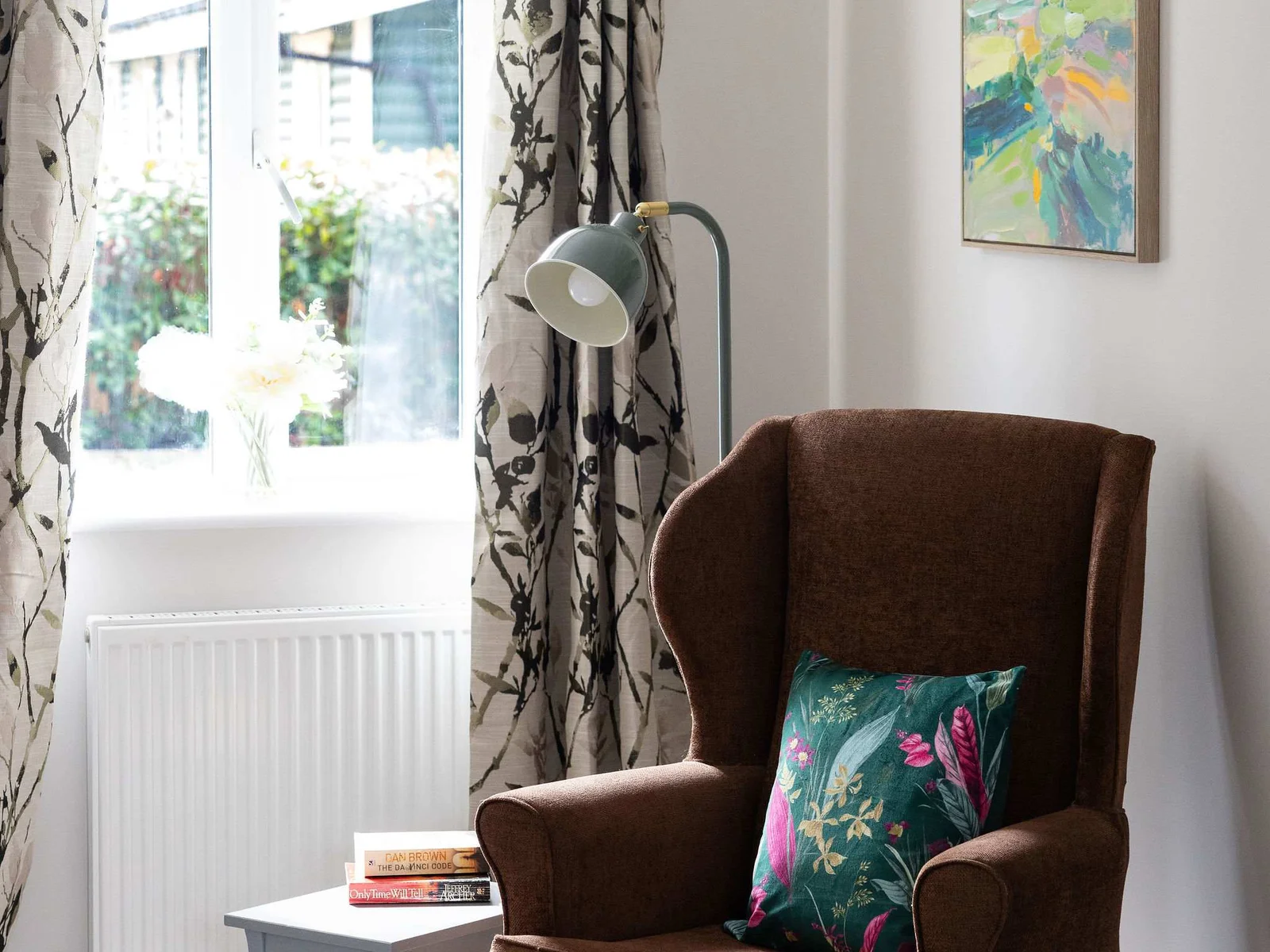A cosy reading nook by the window — the perfect spot to curl up with a book, enjoy a quiet coffee and take a little time to yourself.