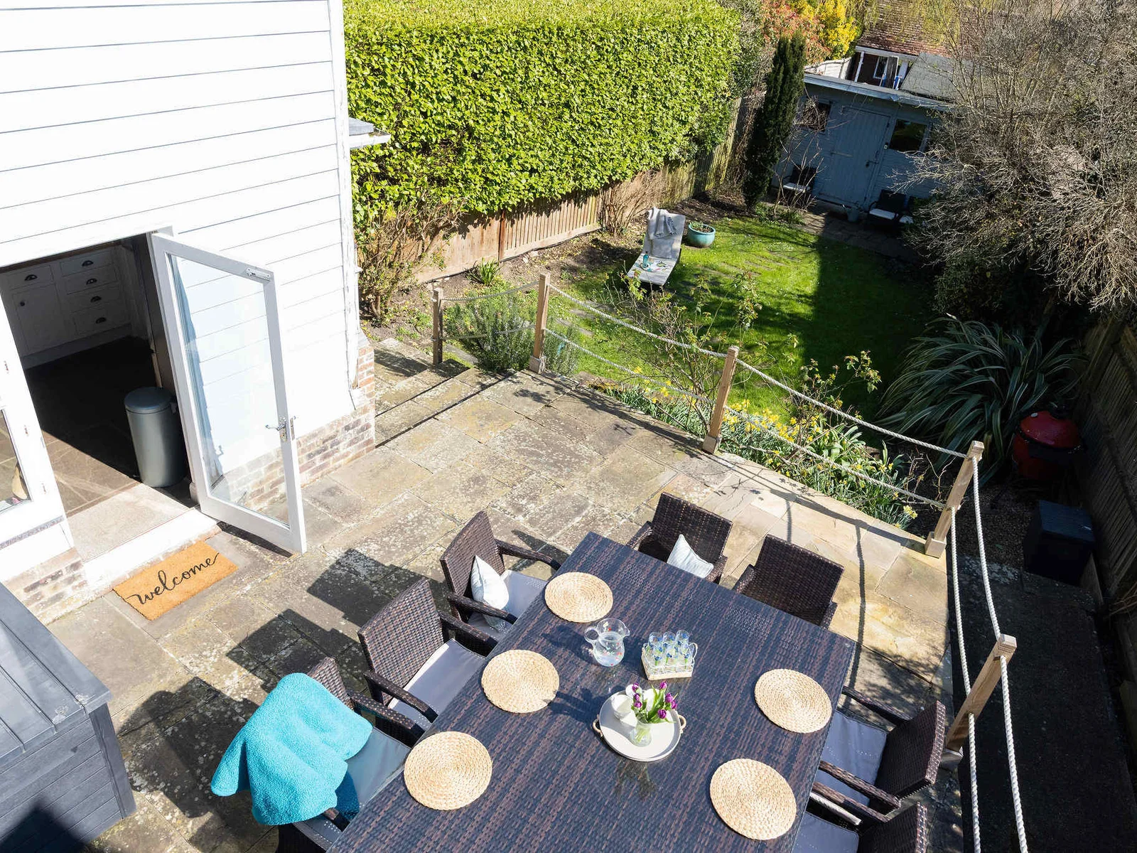 Spacious patio leading down to the enclosed garden