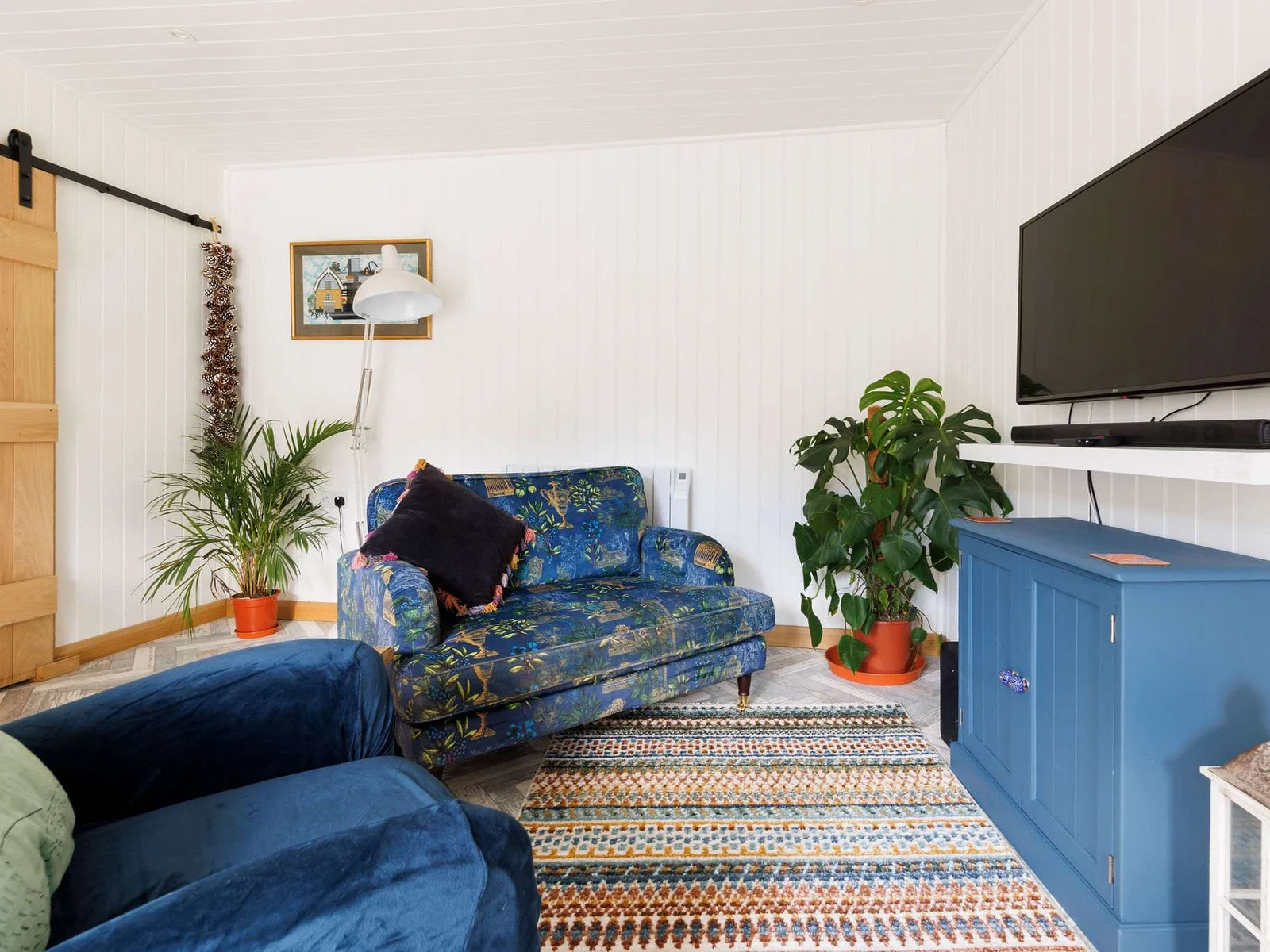 Enjoy a good book on the comfortable sofa with cushions.