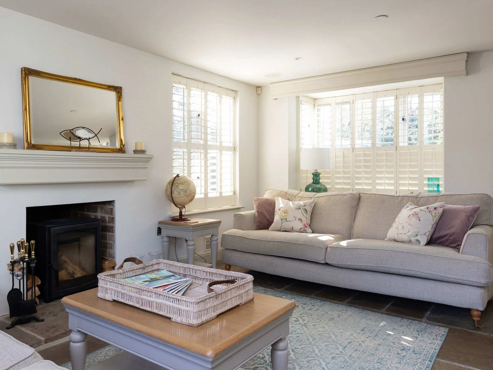 Light-filled lounge with comfortable seating and soft coastal touches
