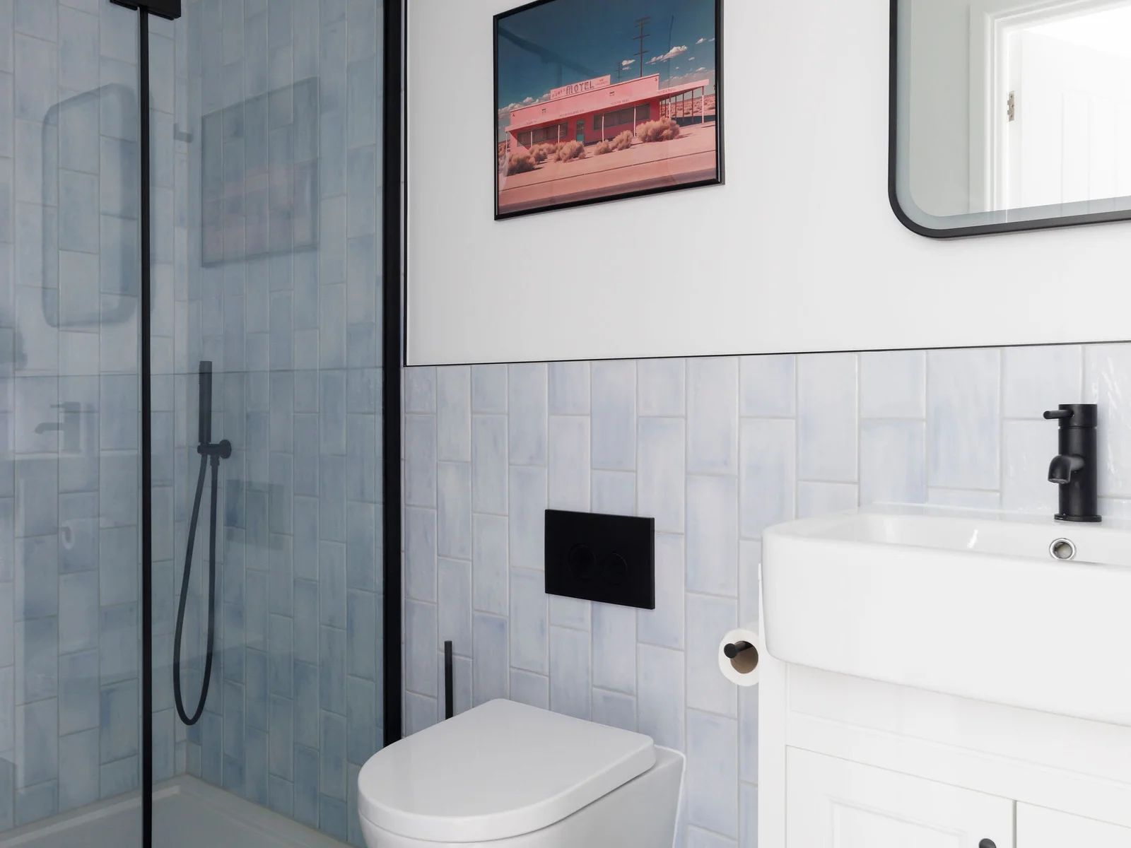 Contemporary master en suite with a glass shower and modern fixtures