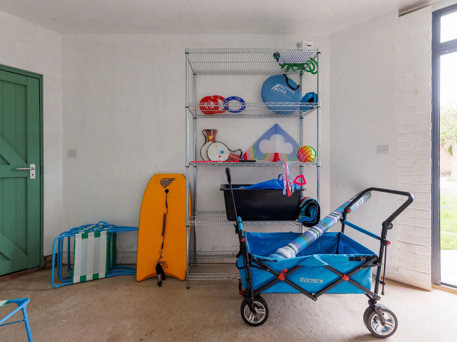 Organised storage area with beach gear, ready for fun outings