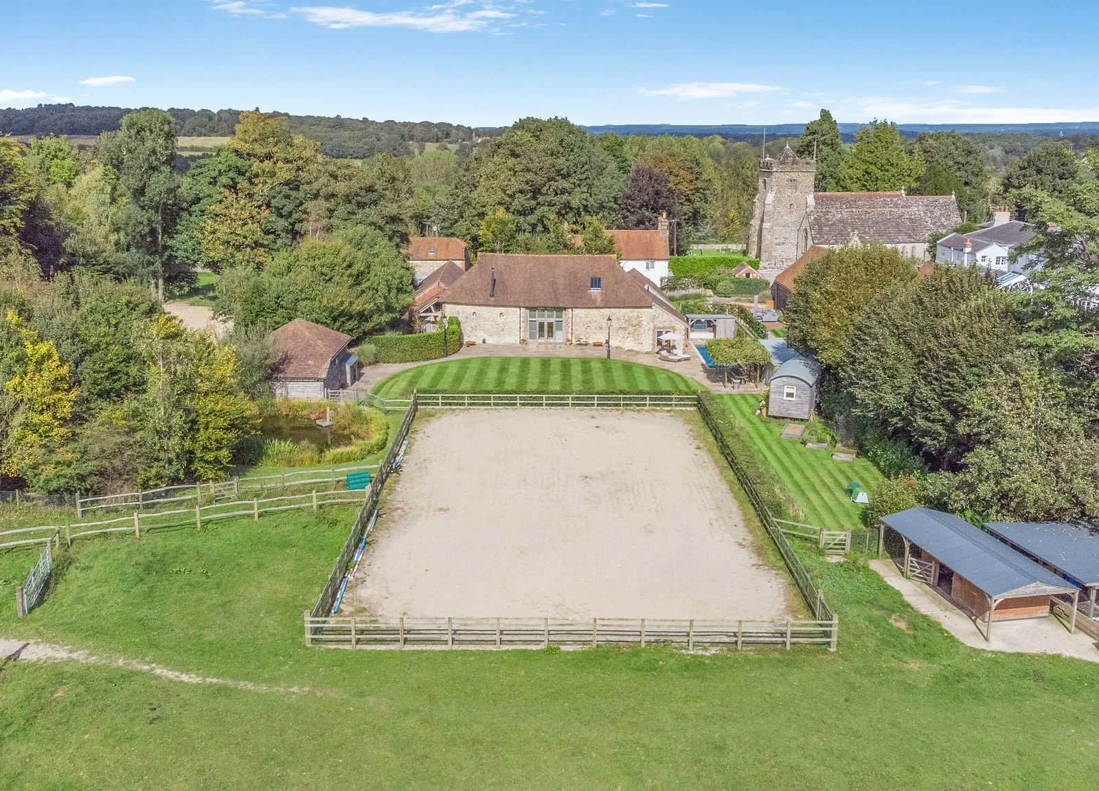 A bird’s-eye view of the estate, including the all-weather manège and equestrian facilities