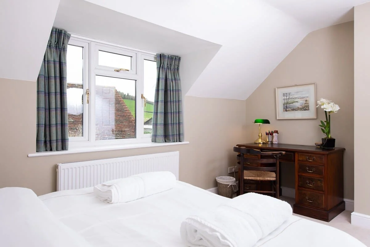 The main bedroom has a desk with lamp for those who need to catch up on emails.