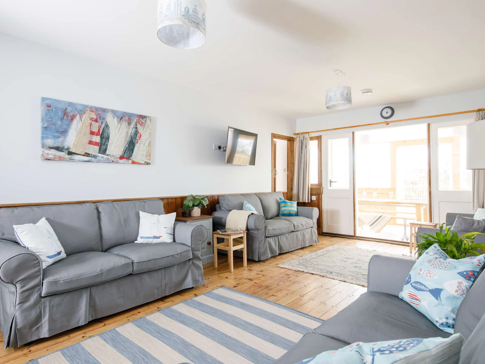There are four comfortable sofas in the main living room